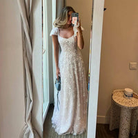 Robe de soirée longue en tulle à bretelles spaghetti et décolleté plongeant pour femme